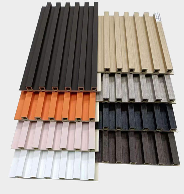Multi-color WPC fluted wall panels collection for interior decorative cladding, featuring wood grain and solid color finishes.