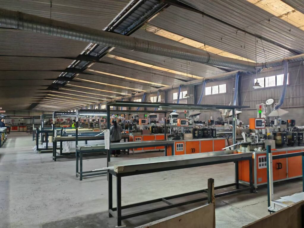 Professional manufacturing area for PVC marble sheets and wpc fluted wall panel, showcasing the automated production line capable of applying high-gloss finishes and luxury stone textures for interior wall decoration